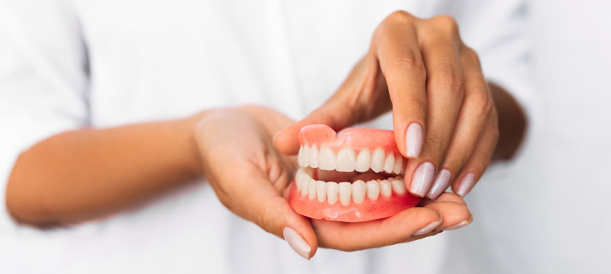 A natural-looking denture designed for comfort and a perfect fit at Woodstock Dentist in Woodstock, GA. Call 678-483-5999 for a consultation.